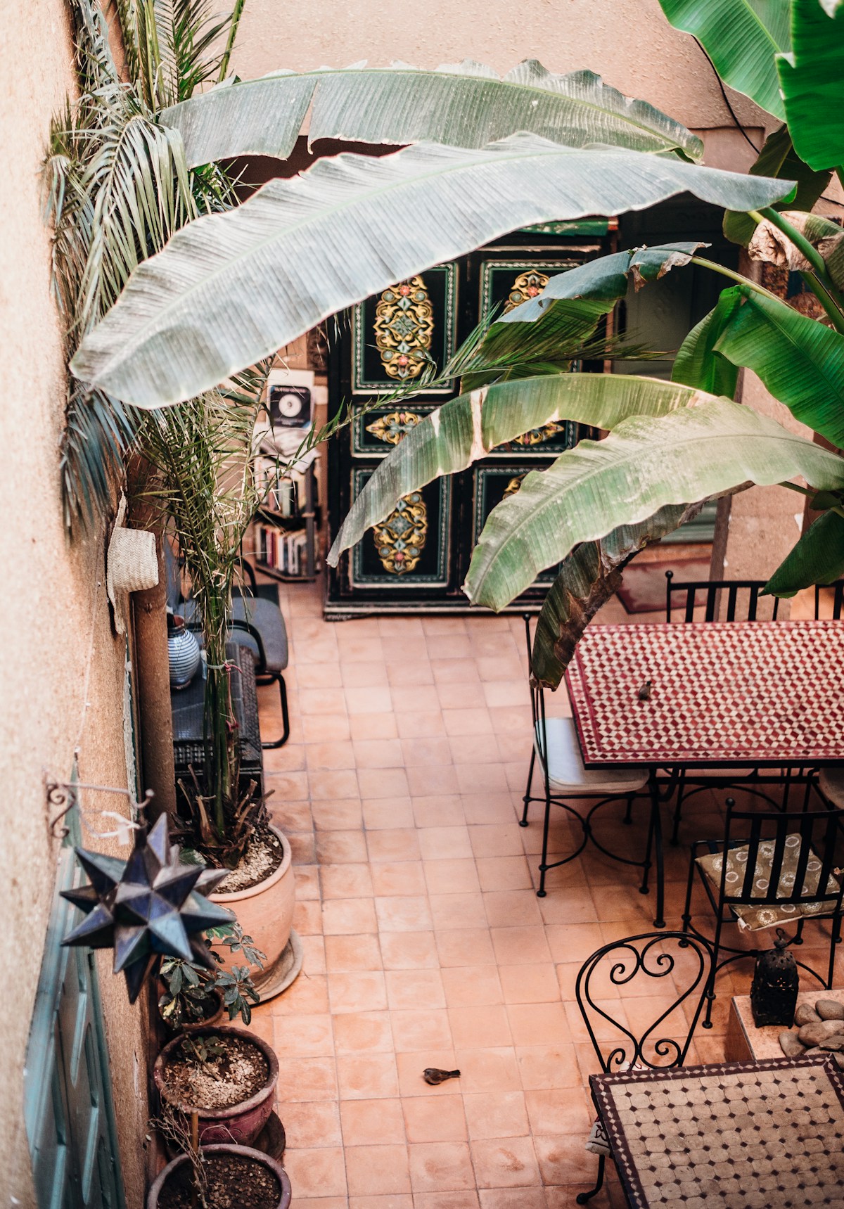 Traditional Moroccan riad rooftop terrace with ornate architecture